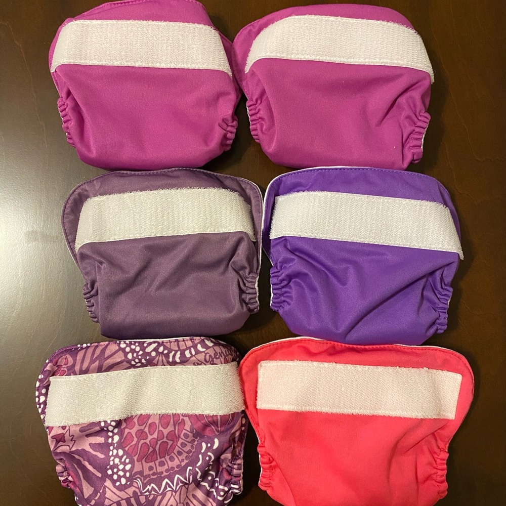 Six BumGenius Newborn AIO Diapers